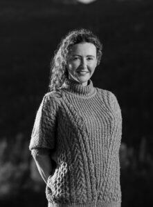dr-sarah-kennea-blacm-and-white-portrait-outside-221x300